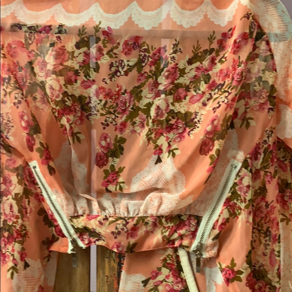Crop flower jacket. White pleather trimming.
